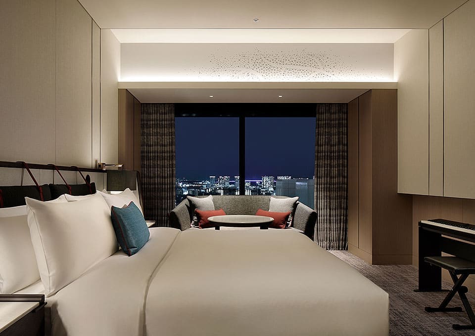 a hotel room with a large bed and a table